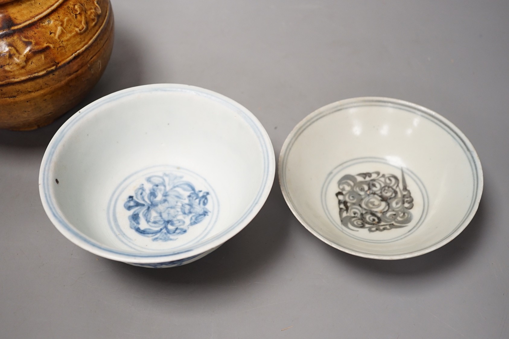 Two Chinese Ming blue and white bowls and a straw glazed jar of Martaban type - tallest 13cm